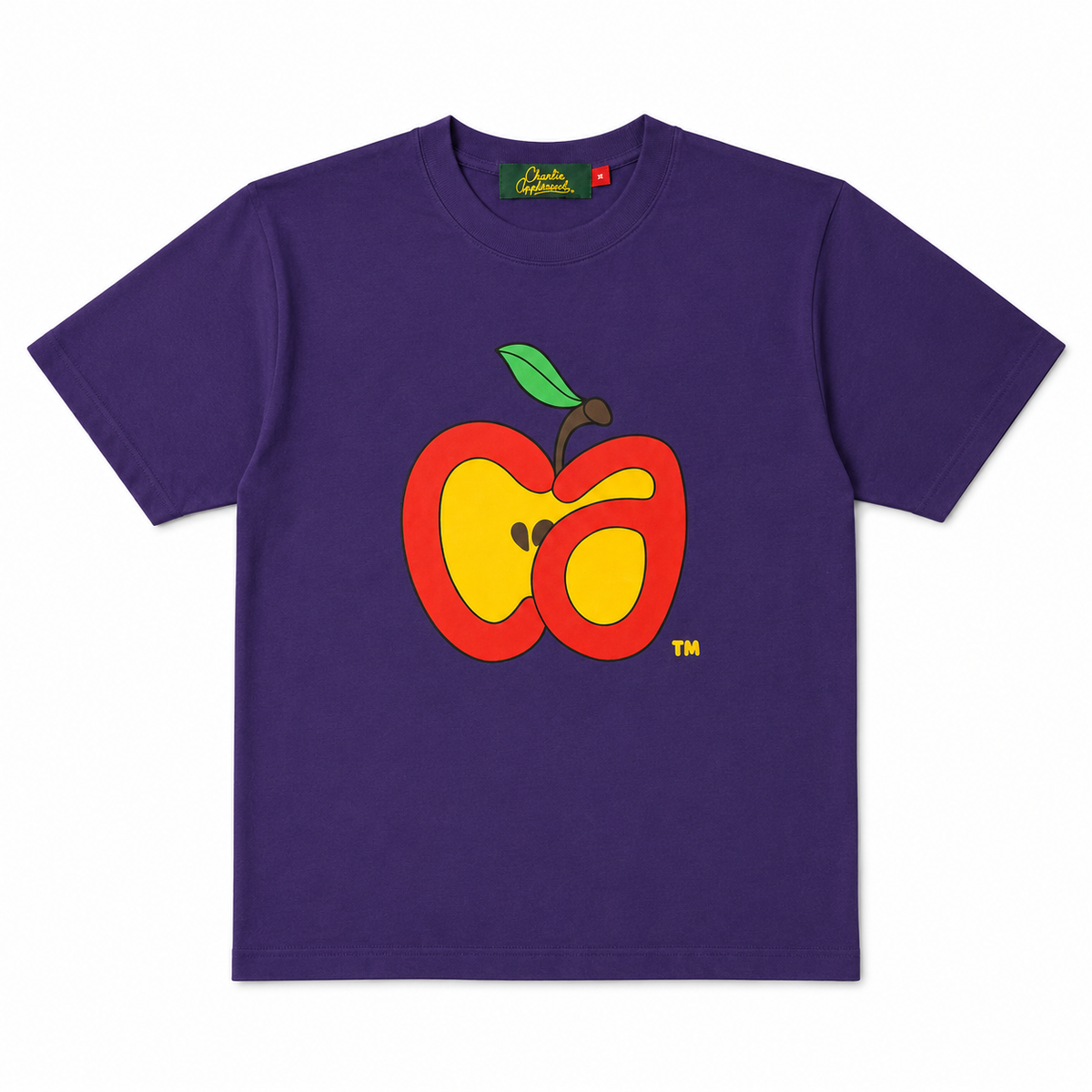 A purple short-sleeve t-shirt with a  graphic of a cut apple on the chest, featuring red, yellow, and green colors. The brand 'Charlie Appleseed' is visible on the inner neck label.