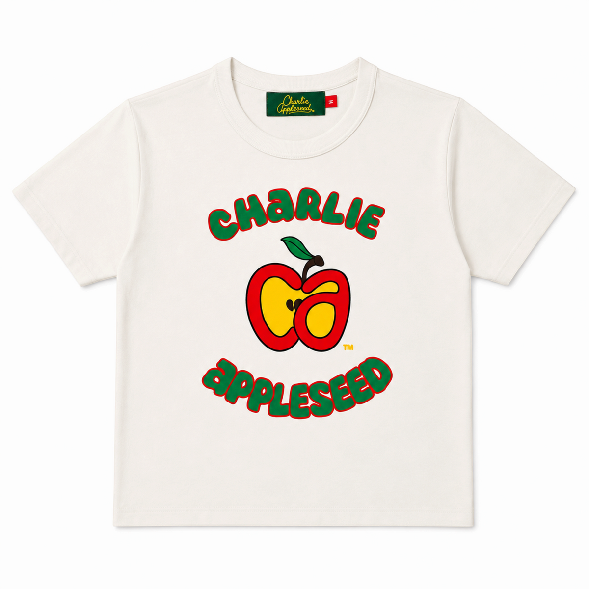 Charlie Appleseed off-white heavyweight cotton t-shirt with a red and yellow puff-print apple logo graphic.